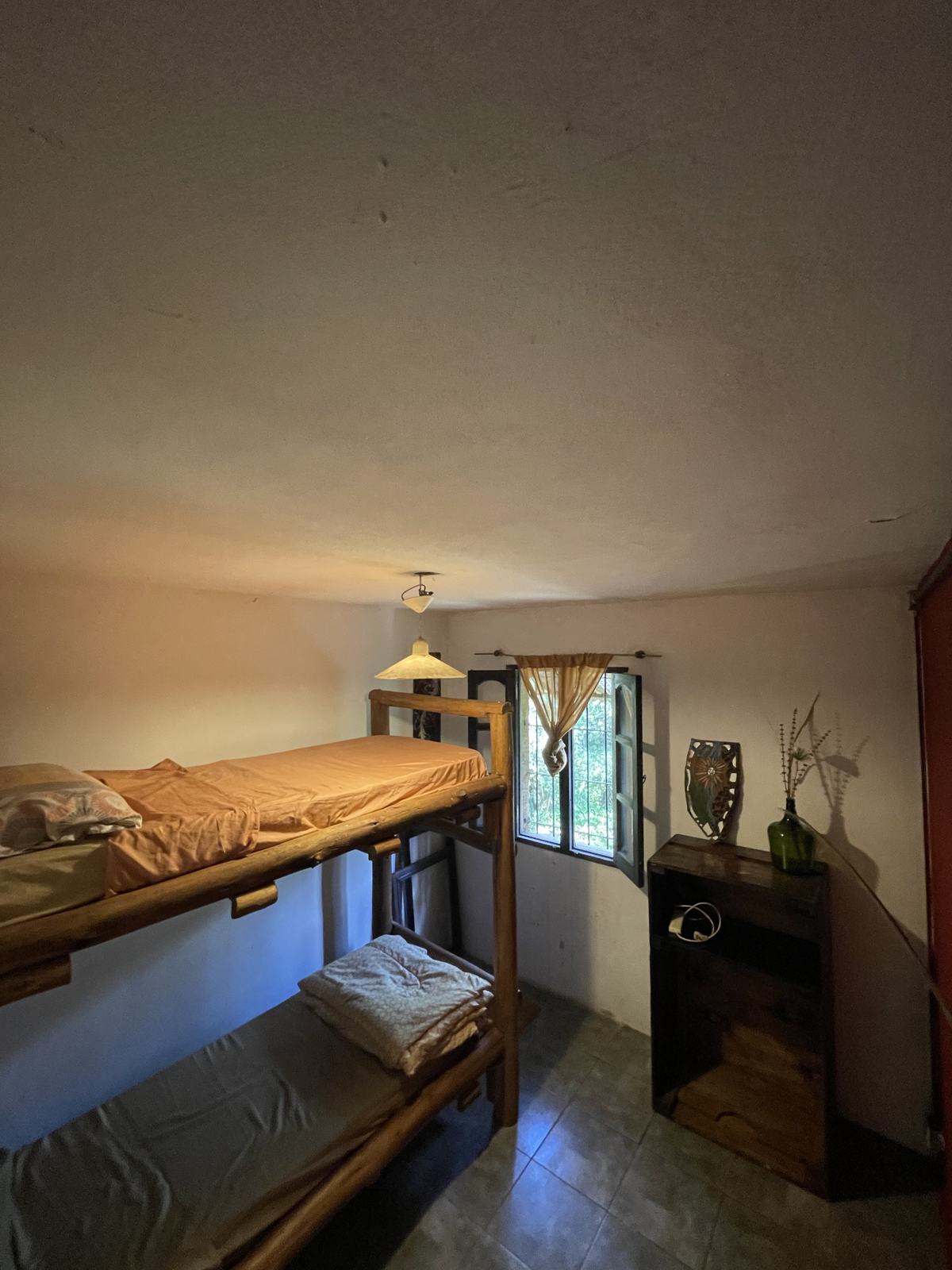 Hostel room with wooden bunk beds